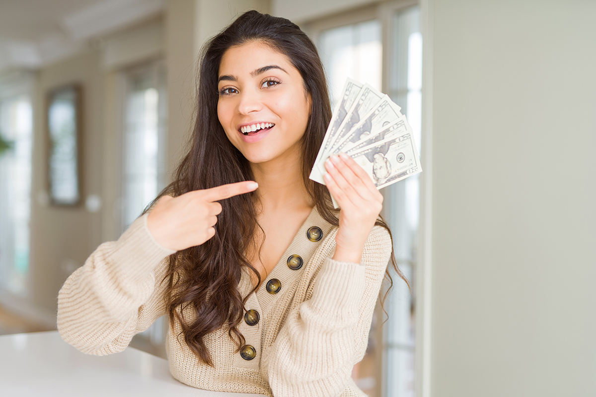 Happy woman with her Borrow & Save funds